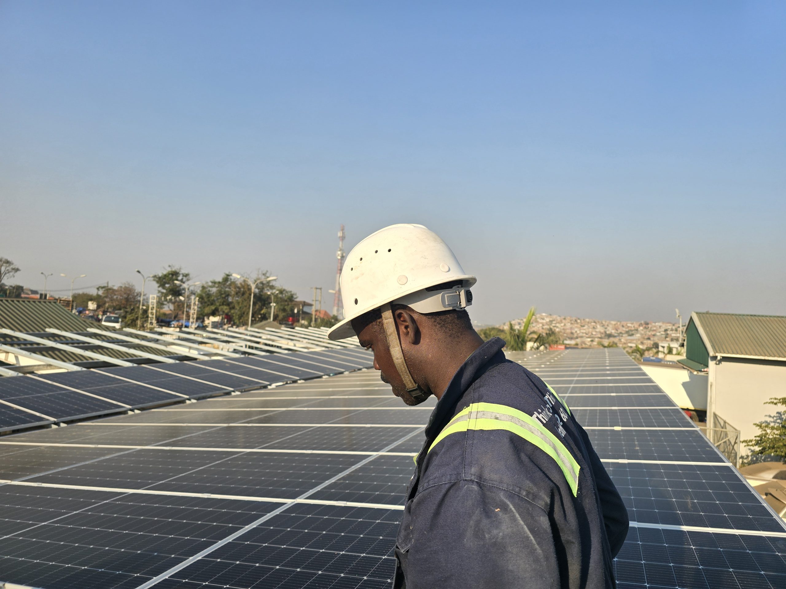 Rex engineer overlooking solar panels